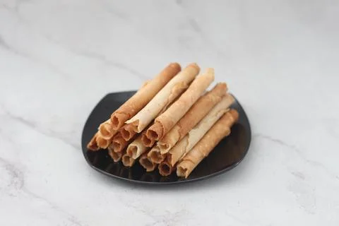 Egg roll or Semprong is snacks that normally serve on Hari Raya or Eid Al Fit Stock Photos