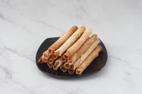 Egg roll or Semprong is snacks that normally serve on Hari Raya or Eid Al Fit Stock Photos