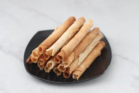 Egg roll or Semprong is snacks that normally serve on Hari Raya or Eid Al Fit Stock Photos