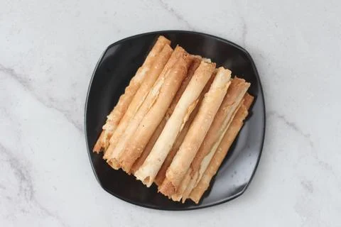 Egg roll or Semprong is snacks that normally serve on Hari Raya or Eid Al Fit Stock Photos