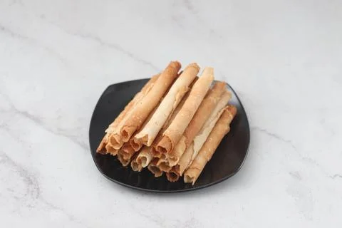 Egg roll or Semprong is snacks that normally serve on Hari Raya or Eid Al Fit Stock Photos