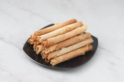 Egg roll or Semprong is snacks that normally serve on Hari Raya or Eid Al Fit Stock Photos