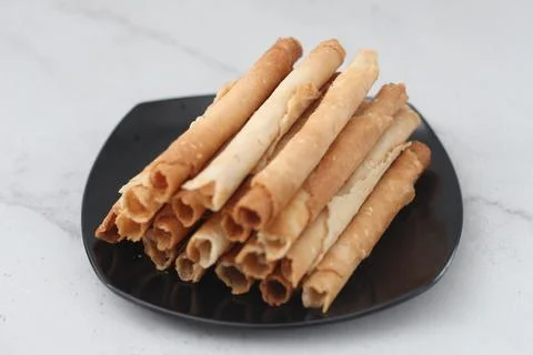 Egg roll or Semprong is snacks that normally serve on Hari Raya or Eid Al Fit Stock Photos