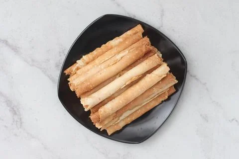 Egg roll or Semprong is snacks that normally serve on Hari Raya or Eid Al Fit Stock Photos