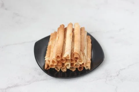 Egg roll or Semprong is snacks that normally serve on Hari Raya or Eid Al Fit Stock Photos
