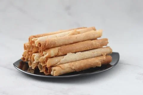 Egg roll or Semprong is snacks that normally serve on Hari Raya or Eid Al Fit Stock Photos