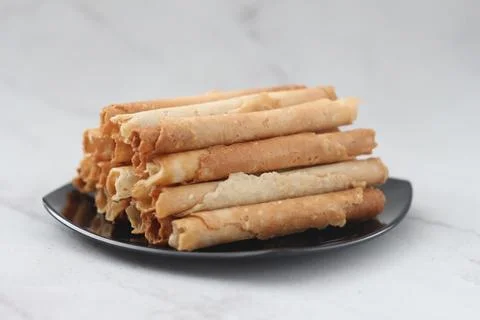 Egg roll or Semprong is snacks that normally serve on Hari Raya or Eid Al Fit Stock Photos