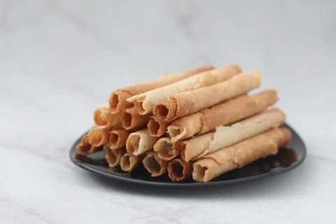 Egg roll or Semprong is snacks that normally serve on Hari Raya or Eid Al Fit Stock Photos