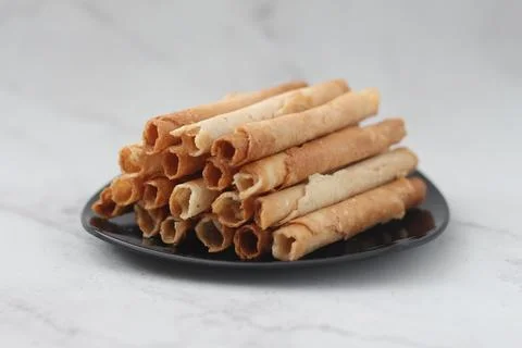 Egg roll or Semprong is snacks that normally serve on Hari Raya or Eid Al Fit Stock Photos