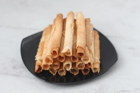 Egg roll or Semprong is snacks that normally serve on Hari Raya or Eid Al Fit Stock Photos