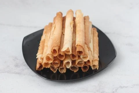 Egg roll or Semprong is snacks that normally serve on Hari Raya or Eid Al Fit Stock Photos