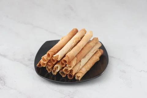 Egg roll or Semprong is snacks that normally serve on Hari Raya or Eid Al Fit Stock Photos