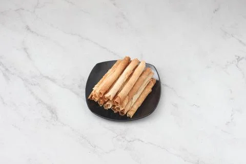 Egg roll or Semprong is snacks that normally serve on Hari Raya or Eid Al Fit Stock Photos