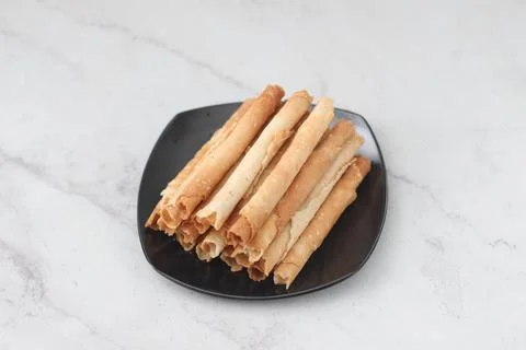 Egg roll or Semprong is snacks that normally serve on Hari Raya or Eid Al Fit Stock Photos