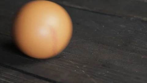 Egg Rolling from Left to Right Closeup Stock Footage 99162741