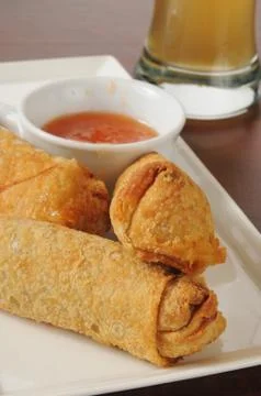 Egg rolls and beer Stock Photos