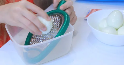 Egg rubbed on a grater Video stock 145933156