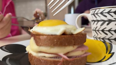 Egg sandwich breakfast fried egg on fresh toasted bread slice on yellow wooden Stock Footage 322644723