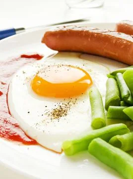 Egg sausages and green beans Stock Photos