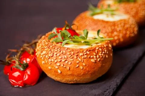Egg served in bread bowl. Breakfast baked eggs in bread bowls with the fresh  Photos