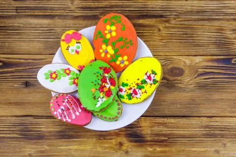 Egg shaped easter gingerbread cookies on wooden table. Top view 写真素材