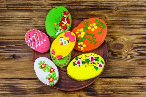 Egg shaped easter gingerbread cookies on wooden table. Top view. 写真素材