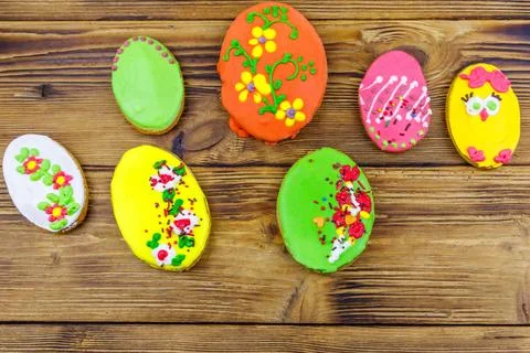 Egg shaped easter gingerbread cookies on wooden table. Top view. Stock Photos