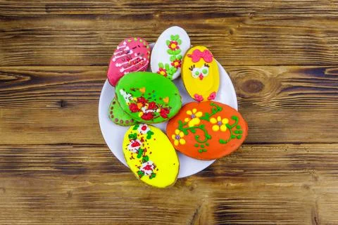 Egg shaped easter gingerbread cookies on wooden table. Top view Stock Photos