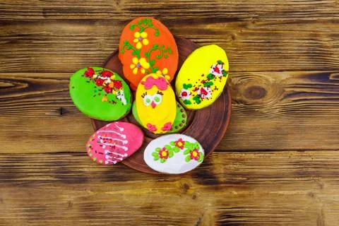 Egg shaped easter gingerbread cookies on wooden table. Top view Stock Photos