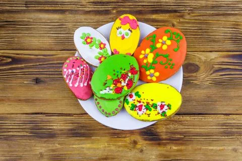 Egg shaped easter gingerbread cookies on wooden table. Top view Stock Photos