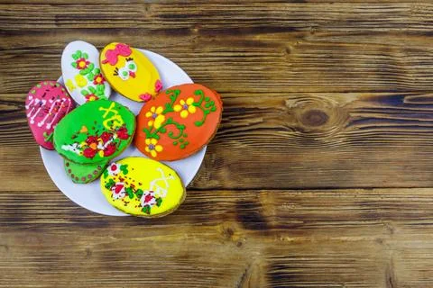 Egg shaped easter gingerbread cookies on wooden table. Top view. Stock Photos