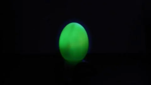 The egg-shaped lantern changes different colors in the dark. World Egg Day Stock Footage 204034793