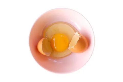 Egg shell  and open Eggs in a pink bowl .Top view closeup. Stock Photos