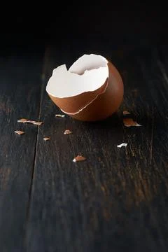 Egg shell broken or crack isolated on black Stock Photos
