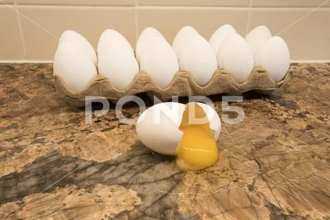 Egg shell on kitchen counter Stock Photos