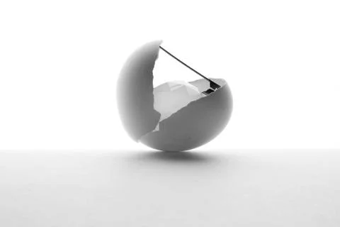 Egg shell pin and diamond on white shiny background Stock Photos