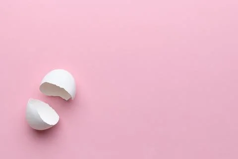 Egg shell on pink background copy space. Happy easter concept. Stock Photos
