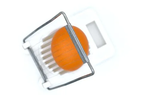 Egg in shell a white egg-cutter. White background, isolate. Kitchen appliance Foto stock