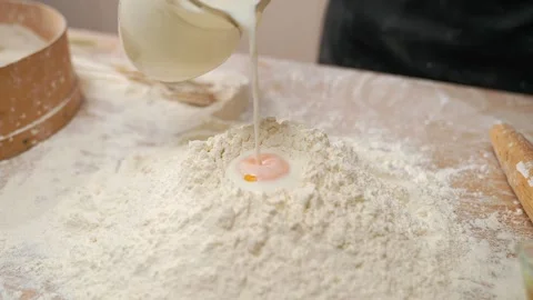 Egg Slowly Falls Into Flour Stock Footage 273500387