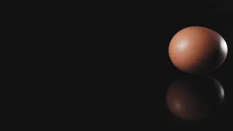 Egg is spinning on a black background. Stock Footage 140302139