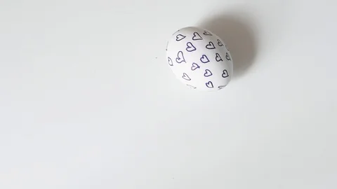 Egg spinning.Chicken egg spinning on white background top view. Egg spinning and Stock Footage 108325284