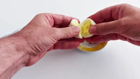 Egg Split-Perfect Halves Revealed in Soft Light Video stock 308705514