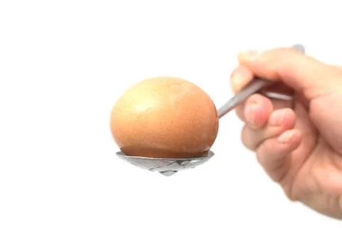 Egg on a spoon Stock Photos