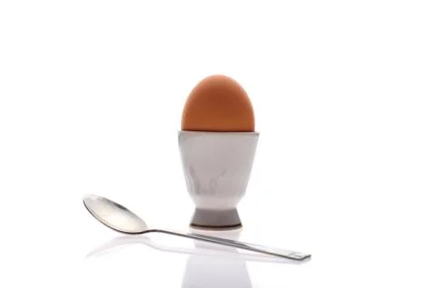 Egg on a stand with a spoon Stock Photos