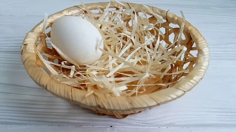 Egg straw falls, slow-motion shooting Stock Footage 89765931