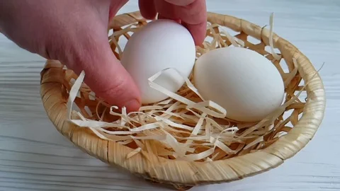 Egg straw hand, slow-motion shooting Video stock 89765864