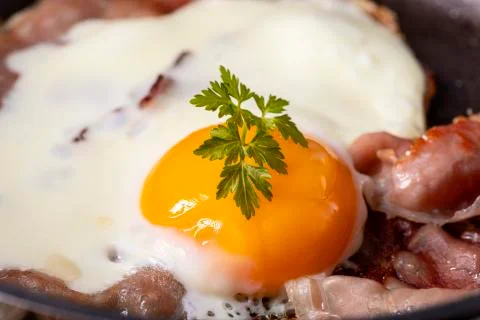 Egg sunny side up in a pan Stock Photos
