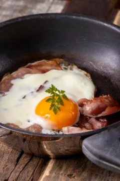 Egg sunny side up in a pan Stock Photos