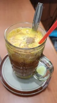 Egg tea, or also known as talua tea, is a traditional drink Stock Photos