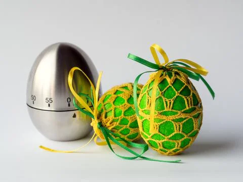 Egg timer and easter eggs Foto stock